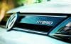 What are the benefits and problems with hybrid cars to the environment?